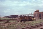 BM 1230 & BM 802 haul welded rail for the MBTA Green Line 'D' Branch past Boston Engine Terminal